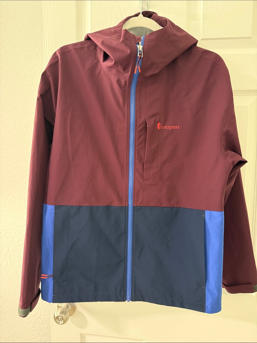cotopaxi Colorblock Hooded Rain Jacket in Burgundy and Blue